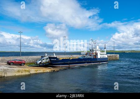 The Eynehallow ferry arrives at Brinian on the Island of Rousay, Orkney Islands, Scotland.