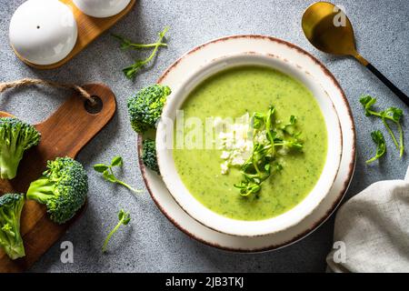 Broccoli cream soup with cream and parmesan. Stock Photo