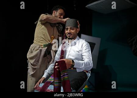 Sanaa, Yemen. 02nd June, 2022. A Yemeni man (l) helps a groom Majd Alshaibany wearing traditional wedding attire ahead of his wedding ceremony in Sanaa. Weddings in Yemen are replete with different social customs and rituals dating back thousands of years. Credit: Hani Al-Ansi/dpa/Alamy Live News Stock Photo