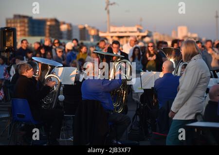 Hove , Brighton UK 2nd June 2022 - Crowds gather for the the lighting of the Queen's Platinum Jubilee LED beacon on Hove seafront this evening as beacons across the country are lit during  the celebrations : Credit Simon Dack / Alamy Live News Stock Photo