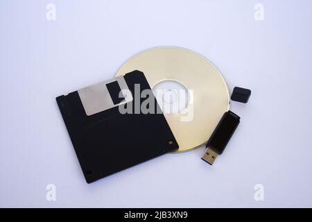 Image of a floppy disk, a cd and a usb key to represent the evolution of technology in information Stock Photo