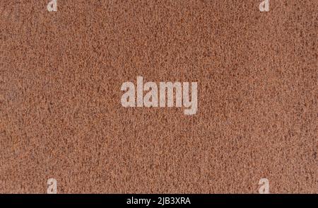 Background, structure of rusty sheet metal. Texture with a porous structure of rusty metal. Stock Photo