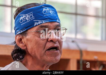 Ketchikan, Alaska, USA - July 17, 2011: Rainforest Sanctuary. Facial closeup of native man face with glasses and blue bandana featuring Alaska Canopy Stock Photo