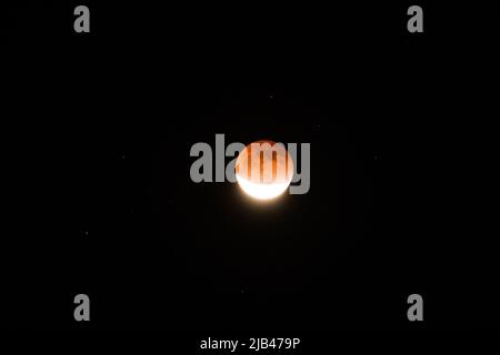 Red moon during total Lunar Eclipse in May 2022 Stock Photo