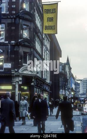 1970s archive photograph of Foyles Bookshop in Charing Cross Road, London, with a large Foyles For Books flag outside. Stock Photo