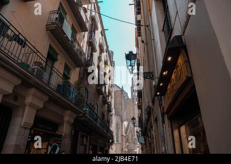 Barcelona, Spain - April 16, 2022 : Classic apartment building with balconies and shutters in Barcelona Stock Photo