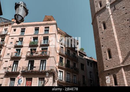 Barcelona, Spain - April 16, 2022 : Classic apartment building with balconies and shutters in Barcelona Stock Photo