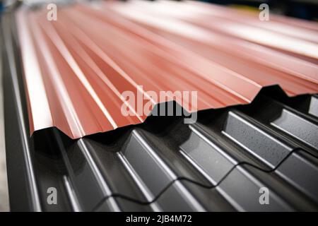 Metal Corrugated roofing profiles in metal roofing factory Stock Photo