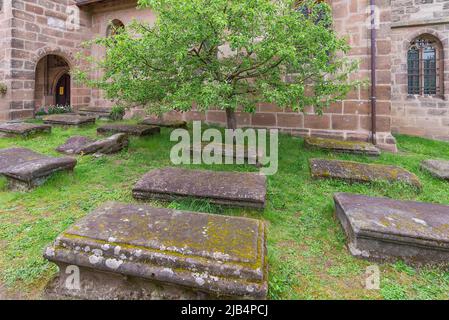 Old graves in the churchyard of the fortified church of St. George, Neunhof near Nuremberg, Middle Franconia, Bavaria, Germany Stock Photo