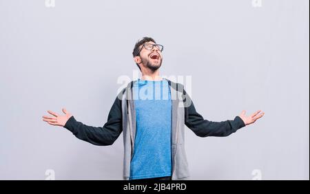 Desperate and angry person shouting with open arms, Angry people shouting up with open arms, Man with open arms shouting angry up Stock Photo