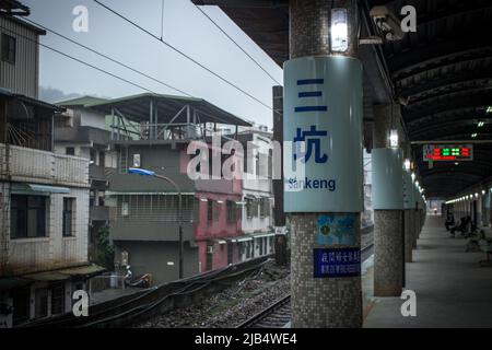 Taipei, Taiwan - Dec 17 2019: Platform of Sankeng, a railway station on the TRA West Coast line located in Ren'ai District, Keelung City, in rainy day Stock Photo