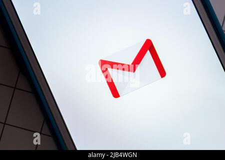 Logo of Gmail, a free email service developed by Google, on white background on iPhone. By 2018, Gmail had 1.5 billion active users worldwide Stock Photo