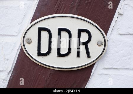 DDR number plate, country number plate on a half-timbered beam, Treseburg, Harz, Saxony-Anhalt, Germany Stock Photo