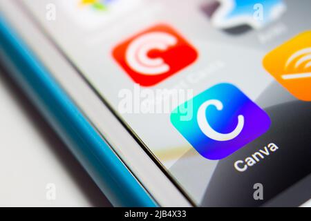 Canva app, a graphic design platform that allows users to create social media graphics, presentations, posters and other visual content, on iPhone. Stock Photo