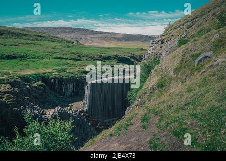 Aerial drone panorama of studlagil canyon in Iceland, picturesque valley with basalt columns standing high on a warm summer day. Overview of the basak Stock Photo