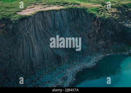 Aerial drone panorama of studlagil canyon in Iceland, picturesque valley with basalt columns standing high on a warm summer day. Closeup of the basakt Stock Photo