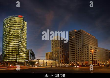 Bahntower on the left and Beisheim-Center with Ritz Carlton Hotel on the right in the evening at Potsdamer Platz, Berlin, Mitte, Germany Stock Photo