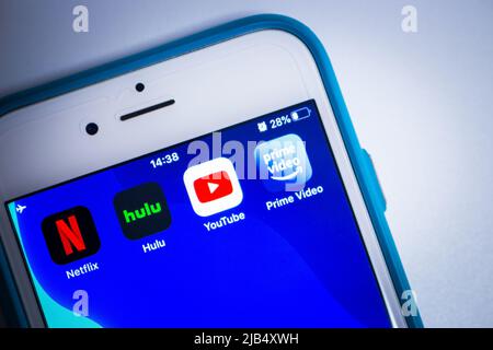 Kumamoto, Japan - May 7 2020 : Conceptual image of 4 big giants of video streaming services (Netflix, Hulu, Youtube and Prime Video) on iPhone screen. Stock Photo