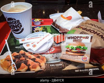 Berlin, Germany - Nov 30, 2016 : Whopper set (coffee, hamburger, chips and sugar) in restaurant. The Whopper is the signature sandwich by Burger King Stock Photo