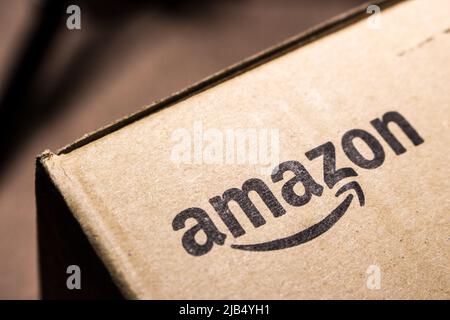 Kumamoto, Japan - Mar 5 2020 : Amazon logo printed on cardboard box. Amazon.com, Inc. is an US technology company based in Seattle, Washington Stock Photo