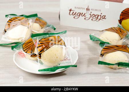 Bakpia Kukus Jogja or Bakpia Tugu, Steamed Mini Round Cake with Mung Bean Paste Inside. On White Table Stock Photo