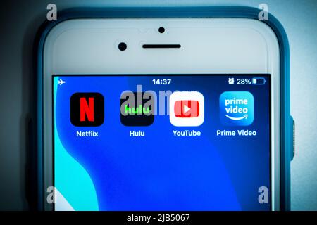 Kumamoto, Japan - May 7 2020 : Conceptual image of 4 big giants of video streaming services (Netflix, Hulu, Youtube and Prime Video) on iPhone screen. Stock Photo
