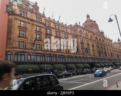 Harrods, a department store located on Brompton Road in Knightsbridge, in cloudy day. It is one of the largest department stores in Europe Stock Photo