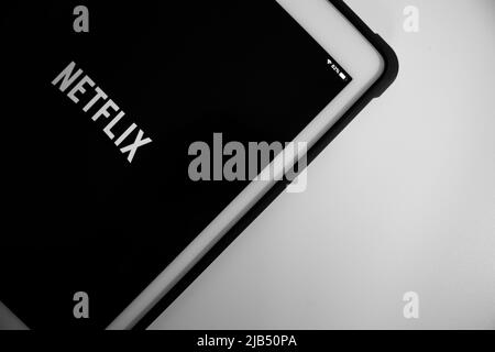 Kumamoto, Japan - May 7 2020 : Netflix logo on iPad in monochrome. Netflix, Inc. is an US media-services provider & production company based in CA Stock Photo
