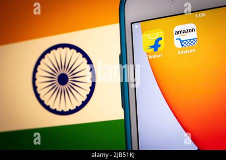 Flipkart, an Singaporean company based in Karnataka, India, with Amazon on iPhone on Indian flag. Flipkart & Amazon are top 2 online retailer in India Stock Photo