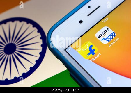 Flipkart, an Singaporean company based in Karnataka, India, with Amazon on iPhone on Indian flag. Flipkart & Amazon are top 2 online retailer in India Stock Photo