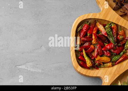 Various spices and herbs on gray background Stock Photo