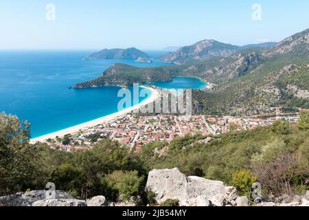 Panoramic aerial view of blue lagoon and sand beach in Oludeniz, Fethiye, Turquoise Coast of southwestern Turkey. Sunny bright and clear blue sky in O Stock Photo