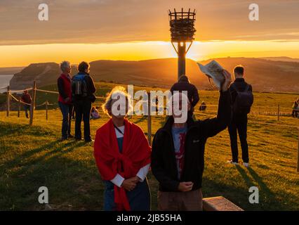 Thorncombe Beacon, Dorset, UK. 02nd June, 2022. Crowds gather to watch the lighting of Thorncombe Beacon on the Dorset coast as part of the QueenÕs Jubilee celebrations Credit: Tom Corban/Alamy Live News Stock Photo