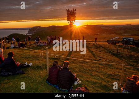 Thorncombe Beacon, Dorset, UK. 02nd June, 2022. Crowds gather to watch the lighting of Thorncombe Beacon on the Dorset coast as part of the QueenÕs Jubilee celebrations Credit: Tom Corban/Alamy Live News Stock Photo
