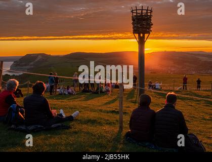 Thorncombe Beacon, Dorset, UK. 02nd June, 2022. Crowds watch the lighting of Thorncombe Beacon on the Dorset coast as part of the QueenÕs Jubilee celebrations Credit: Tom Corban/Alamy Live News Stock Photo