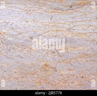 Textured wall lined with shell rock tiles. Stock Photo