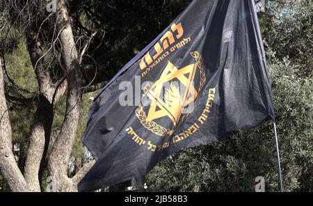 JERUSALEM, ISRAEL - JUNE 02: The flag of Lehava group, notorious for its anti-gay views, flutters during a protest held by far right activists against the gay pride parade on June0 2, 2022 in Jerusalem, Israel. The Jerusalem Gay Pride Parade often meets with counter-protests along its route, and occasionally with violence. Leaders of the Haredi community and other religious groups call for its cancellation each year. Credit: Eddie Gerald/Alamy Live News Stock Photo