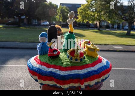 Kent, UK. 02nd June, 2022. To celebrate the Queen's Platinum Jubilee, residents of Bourne Vale in Bromley, Kent, have knitted a tea cosy for their local post box. The topper features a corgi, Grenadier Guard, union jack flag, crown and a tiny Queen. Credit: SOPA Images Limited/Alamy Live News Stock Photo