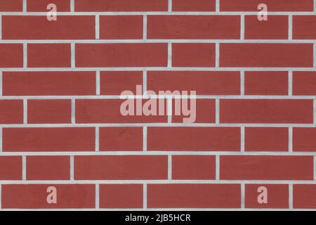 Texture - plastered red wall with painted bricks. Stock Photo