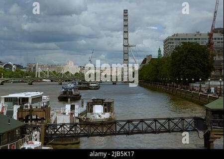 LondonUK - 29 May 2022: View down the river thames london over boats towards london eye Stock Photo