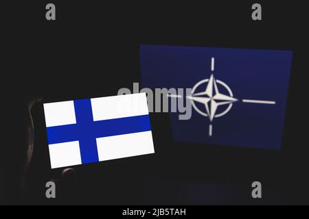 Finland and NATO flag in background. NATO flag in background Stock Photo