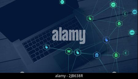 Image of globe and network of connections with icons and laptop Stock Photo