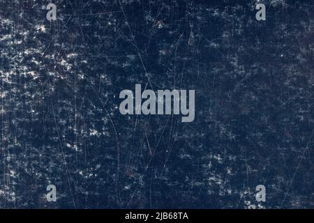 scratched dark blue surface of painted cardboard, flat full-frame background and texture Stock Photo