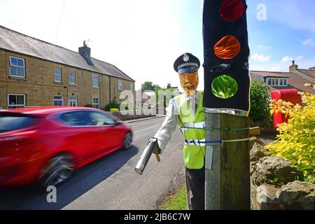 pretend policeman figure with hand held speed gun wass north yorkshire moors united kingdom Stock Photo