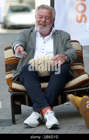 Essen, Germany. 03rd June, 2022. Presenter Harry Wijnvoord sits on an armchair during a photo session before a press conference for the 'Goldene Sonne Spezial,' sonnenklar.TV's gala. Credit: Henning Kaiser/dpa/Alamy Live News Stock Photo