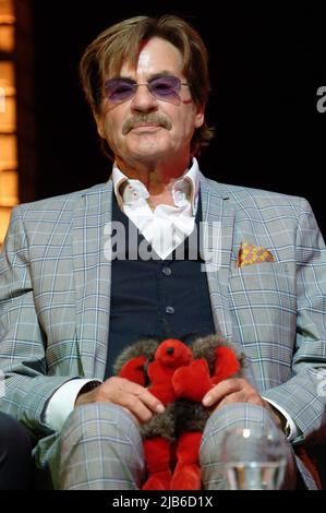 Essen, Germany. 03rd June, 2022. Presenter Harry Wijnvoord sits on the podium at a press conference for the 'Goldene Sonne Spezial,' sonnenklar.TV's gala. Credit: Henning Kaiser/dpa/Alamy Live News Stock Photo