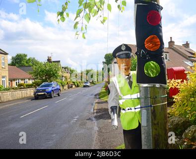 pretend policeman figure with hand held speed gun wass north yorkshire moors united kingdom Stock Photo