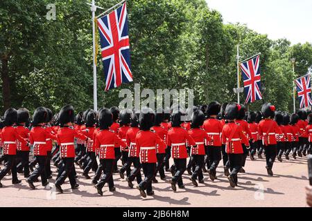 2 June 2022 - Grenadier Guards marching all the Mall in London for Queen Elizabeth's platinum jubilee procession during the Trooping of the Colour Stock Photo