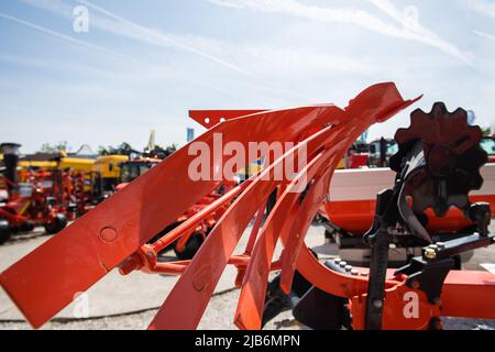 Plow machinery at the agricultural fair outdoor Stock Photo