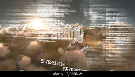 Image of numbers and computer code processing over sunset sky Stock Photo